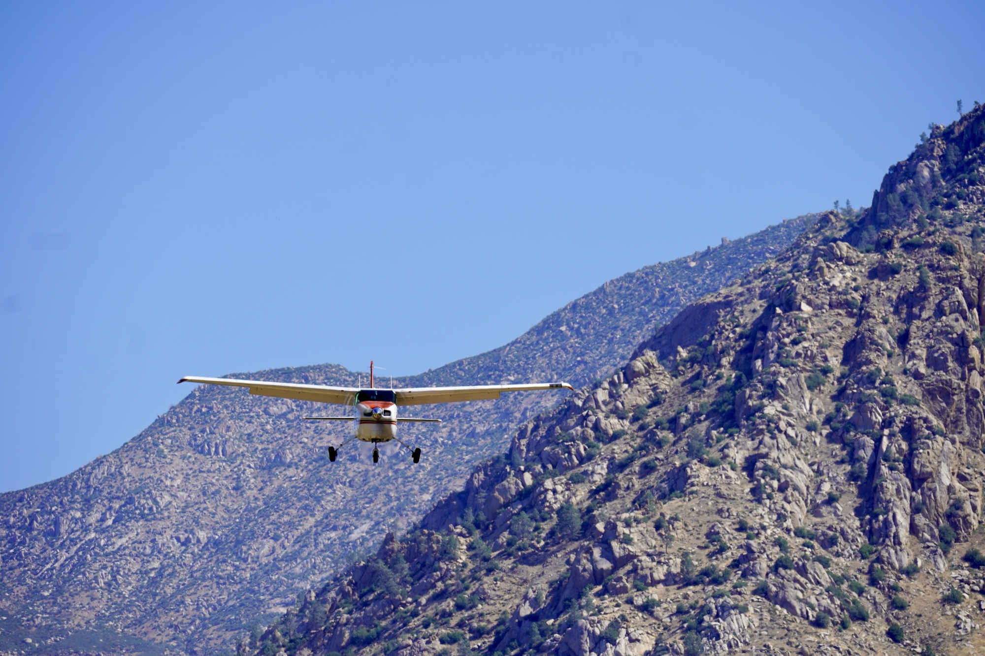 Kern Valley Flyout A Cessna on final approach into Kern Valley Airport (L05), framed by the surrounding ridgeline.